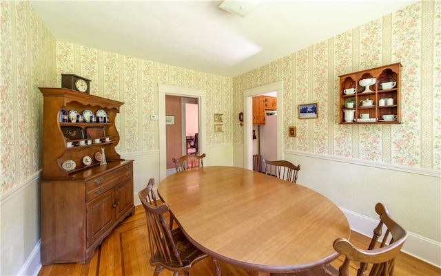 dining space with light wood-type flooring