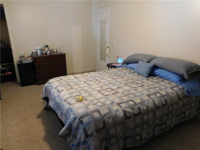 bedroom featuring light colored carpet