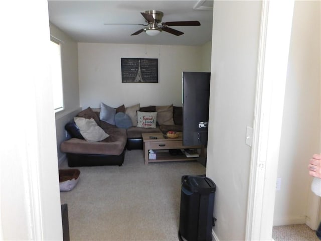 living room featuring ceiling fan and carpet floors