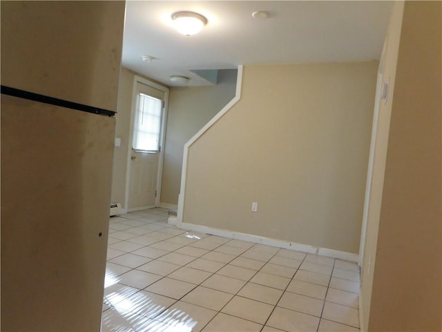 basement featuring light tile patterned floors