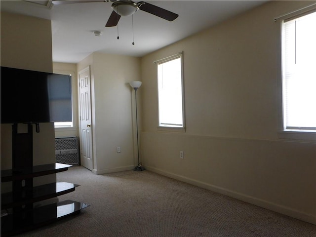 interior space with ceiling fan and a healthy amount of sunlight