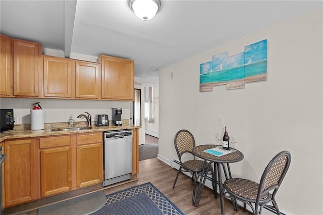 kitchen featuring sink, dark hardwood / wood-style flooring, stainless steel dishwasher, range, and light stone counters