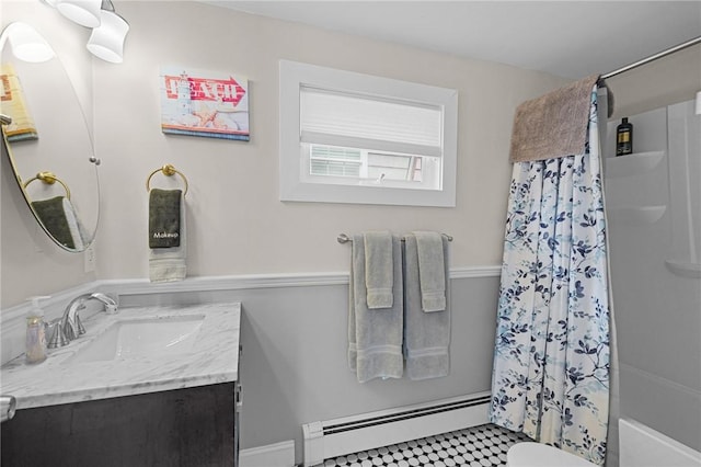 bathroom featuring vanity, baseboard heating, and toilet