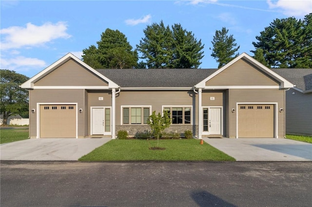 ranch-style home featuring a front lawn and a garage