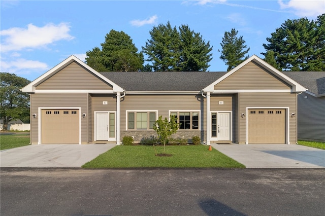 single story home with a front yard and a garage