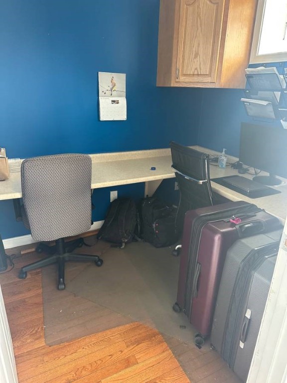 office area featuring light hardwood / wood-style flooring and built in desk