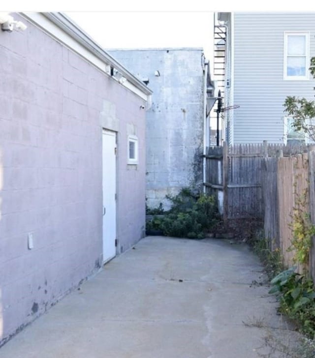 view of property exterior with a patio