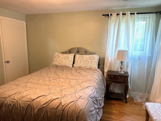 bedroom with wood finished floors