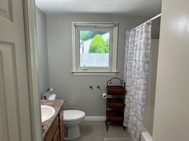 bathroom with shower / tub combo with curtain, toilet, vanity, baseboards, and tile patterned floors