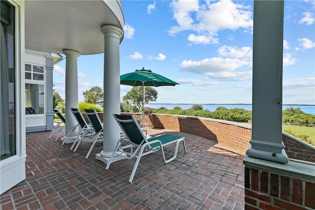 view of patio featuring a water view