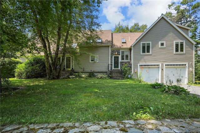 view of front facade with a front lawn and a garage