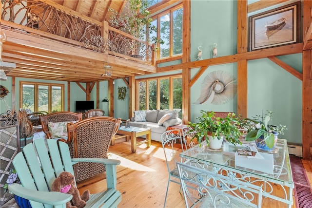 sunroom / solarium with vaulted ceiling with beams and wood ceiling