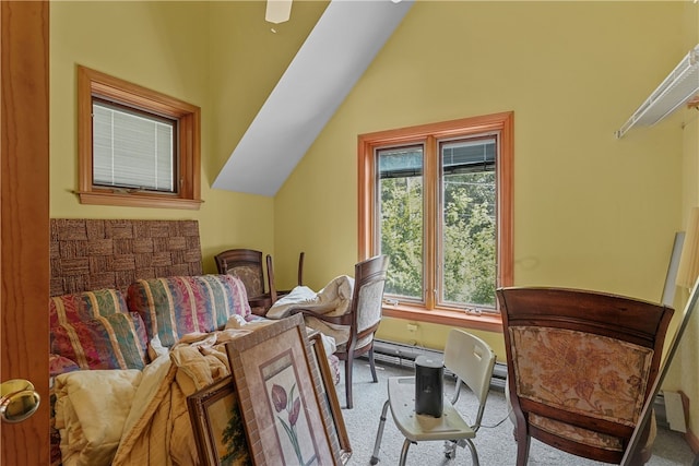 sitting room featuring carpet floors and vaulted ceiling