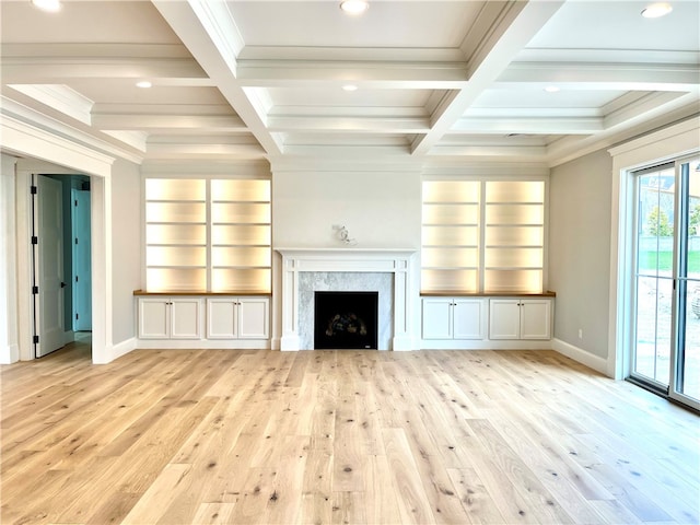 unfurnished living room featuring light hardwood / wood-style floors, coffered ceiling, and a high end fireplace