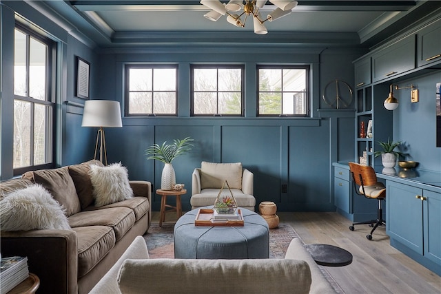 sunroom featuring ceiling fan