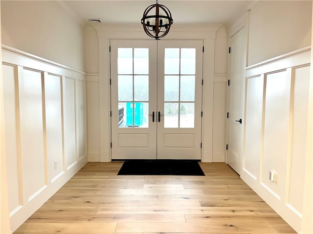 doorway to outside with light wood-type flooring and french doors