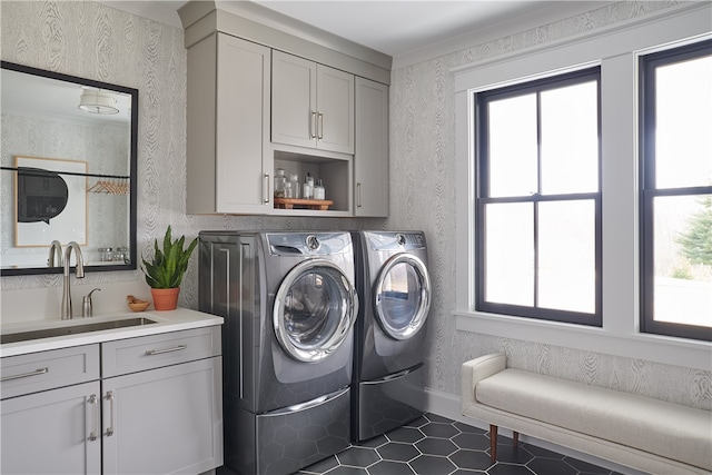 laundry area featuring cabinets, independent washer and dryer, tile patterned flooring, and sink