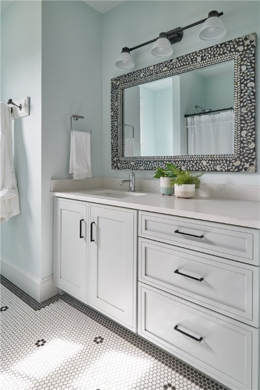 bathroom featuring tile patterned floors and vanity