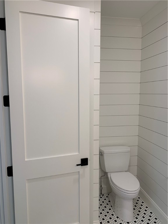 bathroom with tile patterned flooring and toilet