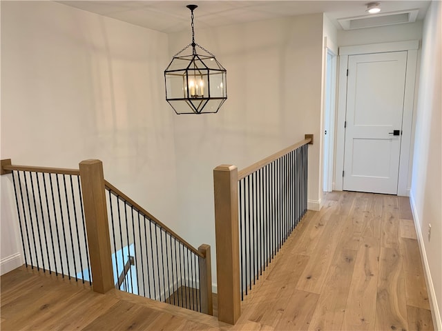 interior space featuring a chandelier and light wood-type flooring