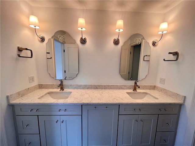 bathroom featuring dual bowl vanity