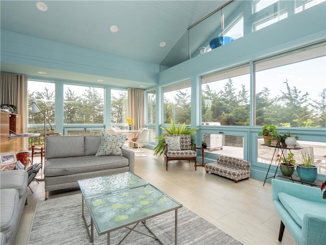 sunroom / solarium featuring vaulted ceiling