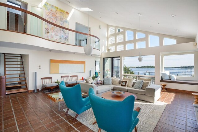 150 Southern Way, Charlestown, RI 02813 - living room featuring high vaulted ceiling, a water view, stairway, baseboards, and recessed lighting