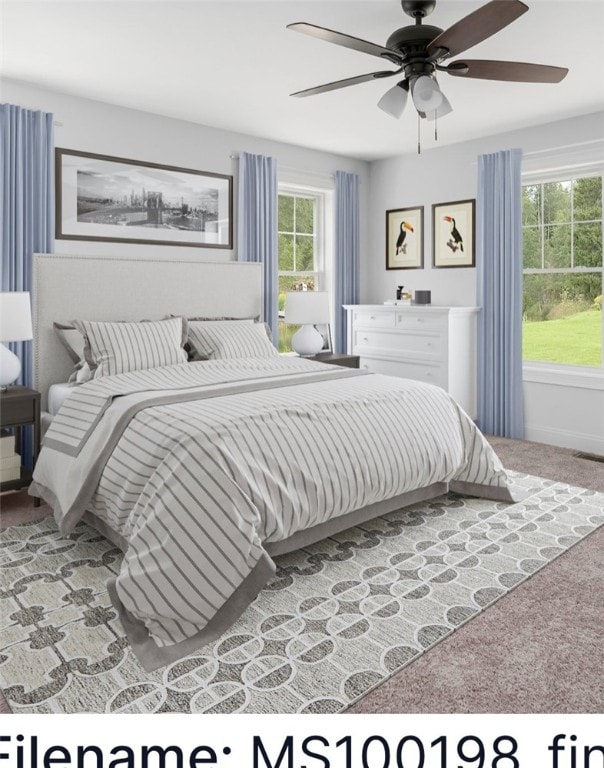 carpeted bedroom featuring ceiling fan and multiple windows