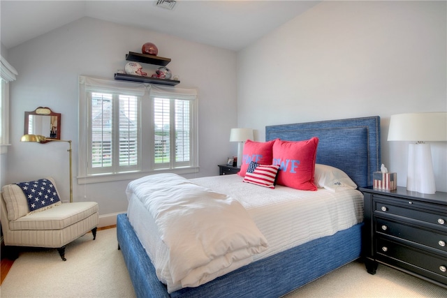 bedroom with lofted ceiling