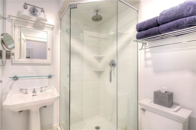 bathroom featuring a shower with door