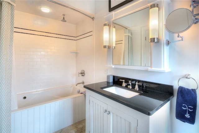 bathroom with tile patterned flooring, vanity, and shower / tub combo