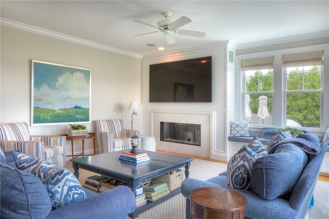 living room with ceiling fan, crown molding, and hardwood / wood-style flooring