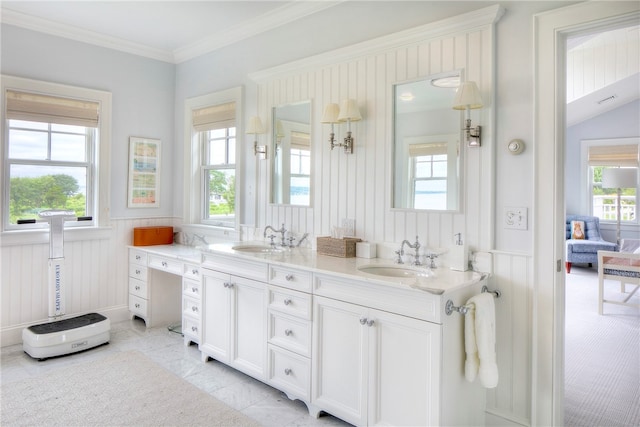 bathroom with a wealth of natural light, crown molding, dual bowl vanity, and tile patterned flooring