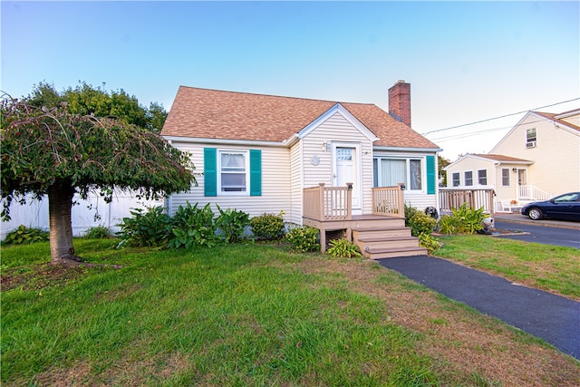 bungalow with a front lawn