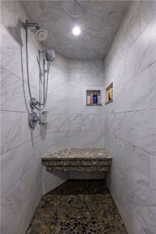 bathroom with a tile shower