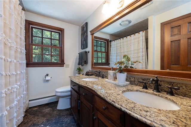 bathroom with tile patterned flooring, toilet, double vanity, and baseboard heating