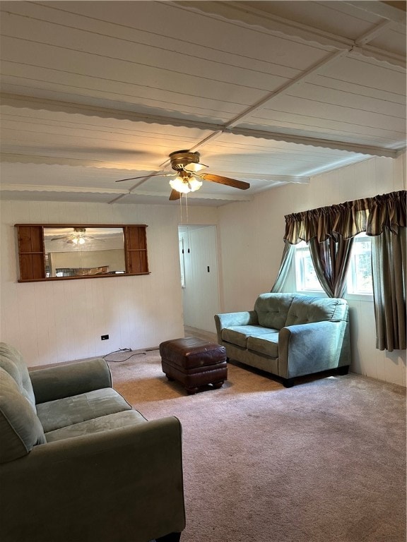 carpeted living room with ceiling fan