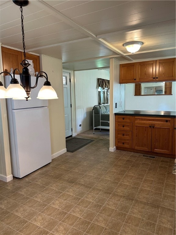 kitchen featuring white refrigerator and tile patterned floors