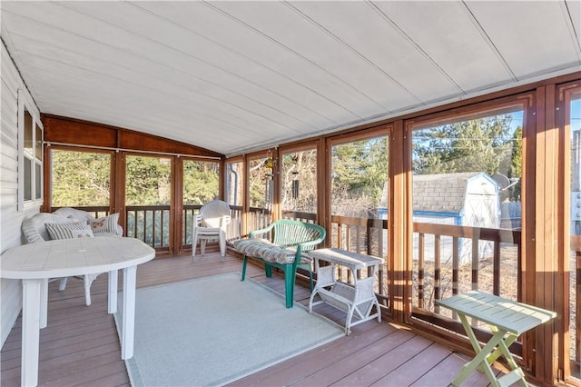 sunroom / solarium with vaulted ceiling