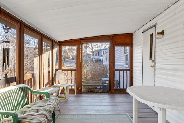 sunroom / solarium with vaulted ceiling