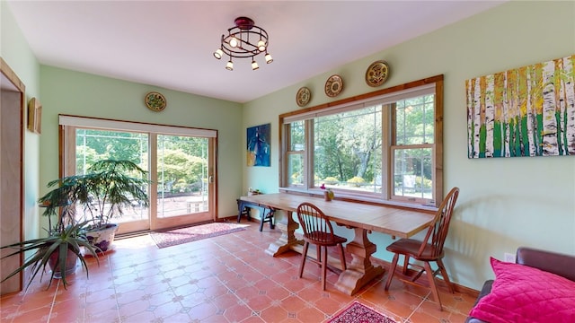 dining space featuring tile patterned floors