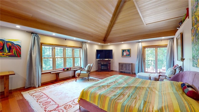 bedroom featuring vaulted ceiling, wooden ceiling, and hardwood / wood-style flooring