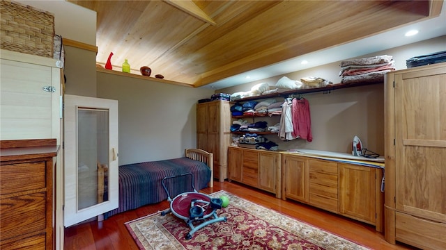 interior space featuring wooden ceiling and hardwood / wood-style flooring