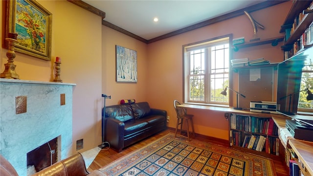 home office with plenty of natural light, crown molding, and wood-type flooring