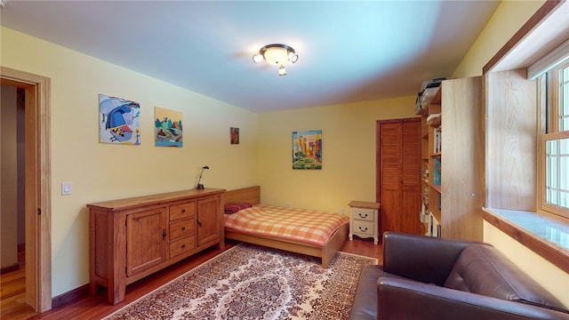 bedroom featuring dark hardwood / wood-style flooring