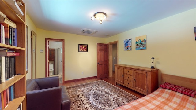 bedroom with wood-type flooring