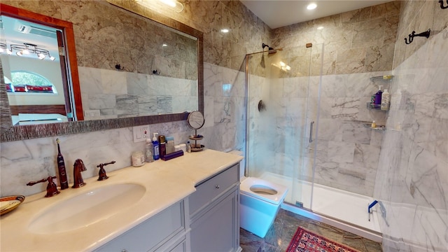 bathroom featuring decorative backsplash, vanity, tile walls, toilet, and a shower with door