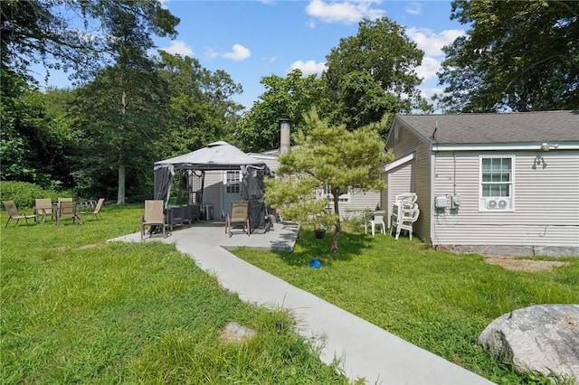 view of yard featuring a gazebo and a patio area