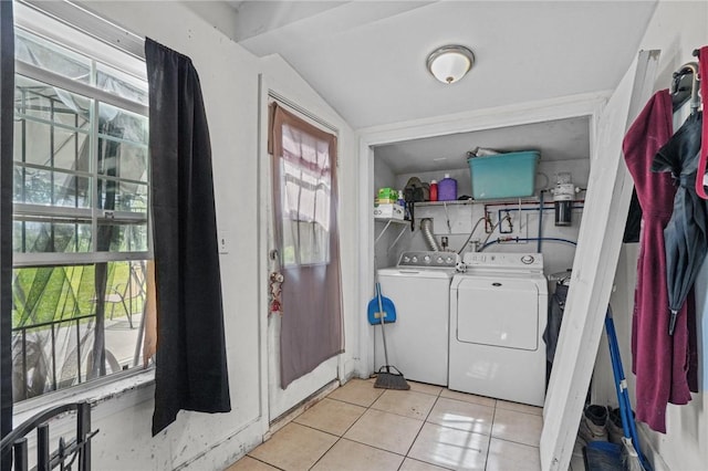 washroom with laundry area, light tile patterned flooring, and independent washer and dryer