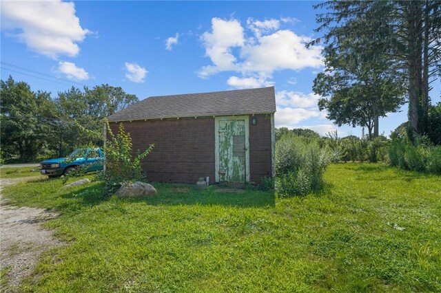 view of outdoor structure with a lawn